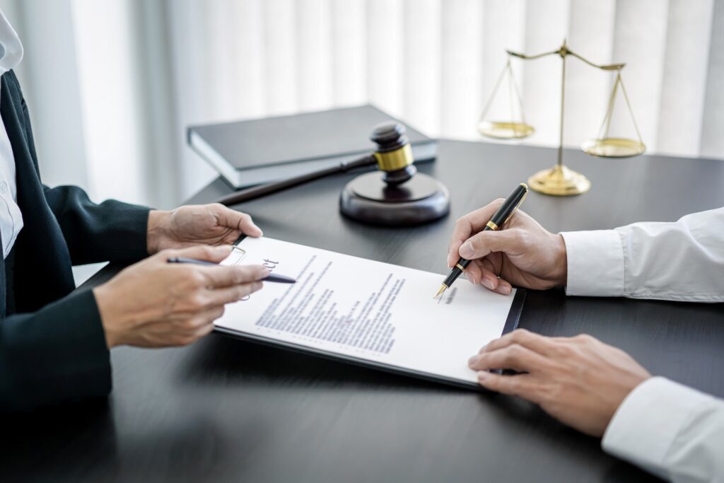 Male lawyer working consulting and discussion to businesswoman client in the office, Law and Legal